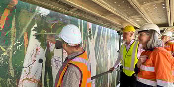 Artist Colin Passmore working on the mural at Unitywater's Peregian Beach reservoir