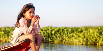 Caption: Chamnan, 10, on the Basac river in Saang District, Cambodia, Feb 2023.  Credit:  WaterAid/ Tariq Hawari