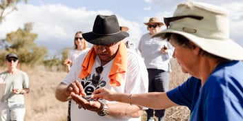 Dr Phil Duncan sharing a cultural practice during an on-Country immersion.