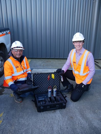 Senior Engineer Network Asset Performance Pankaj Mistry (left) and TasWater Acting Department Manager Asset Strategy and Performance Matt Jordan test a ZoneScan logger, which detects the sound of leaks underground.